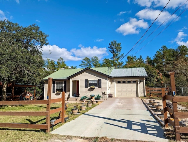 view of front of property with a front yard and a garage