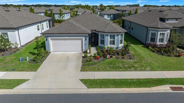 view of front of property with a garage and a front yard