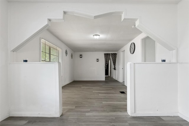 corridor with hardwood / wood-style flooring