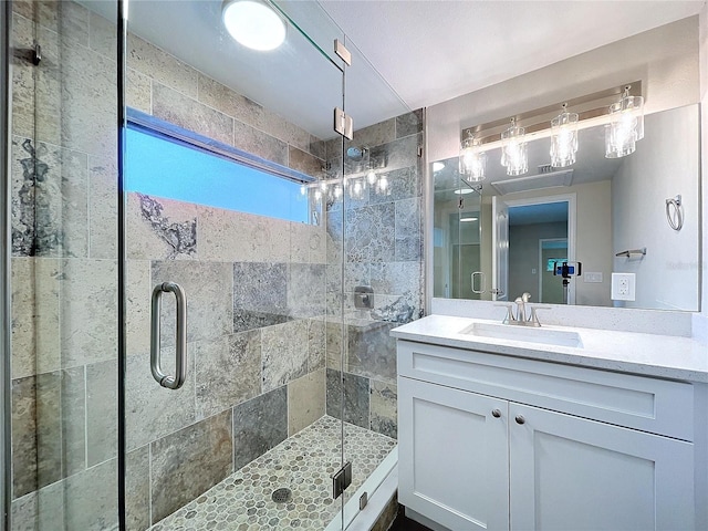 bathroom with vanity and an enclosed shower