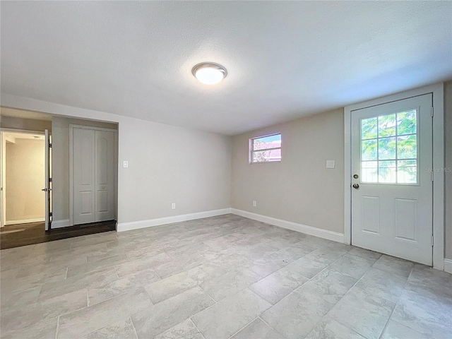 interior space with a textured ceiling