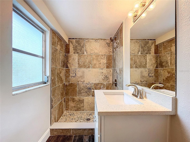 bathroom with vanity and walk in shower