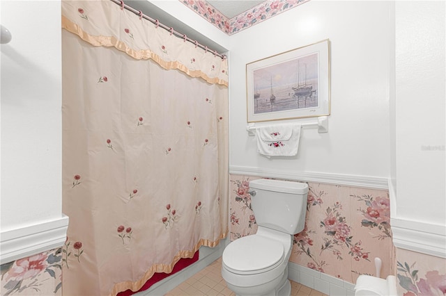 bathroom featuring tile patterned floors and toilet