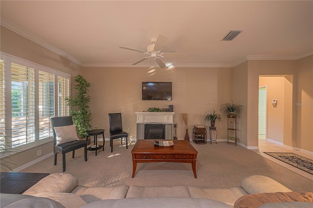 carpeted living room with ceiling fan and crown molding