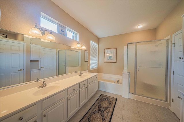 bathroom with vanity, tile patterned flooring, and plus walk in shower