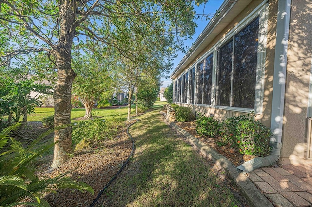 view of yard with a sunroom