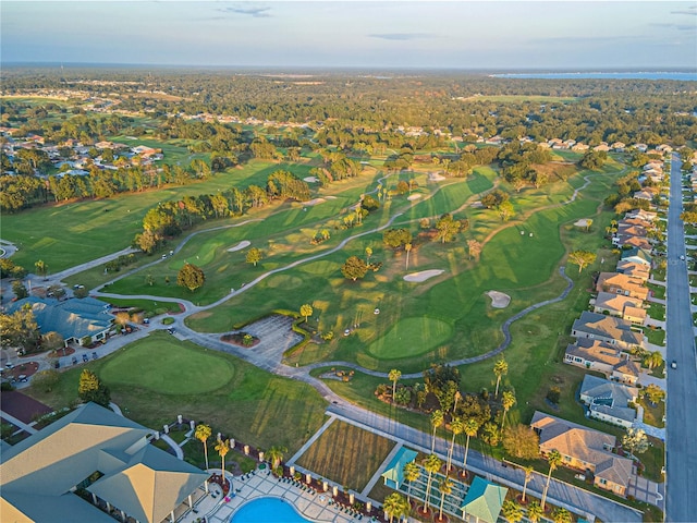 drone / aerial view featuring golf course view and a residential view