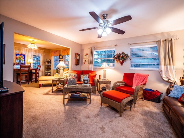 carpeted living room featuring ceiling fan