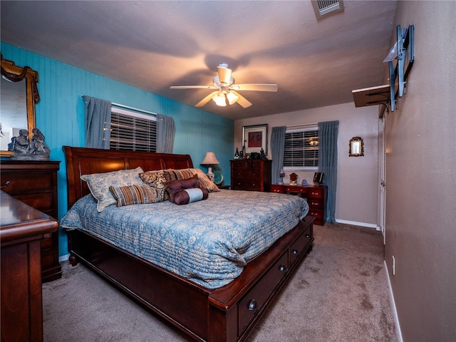 bedroom with light carpet and ceiling fan