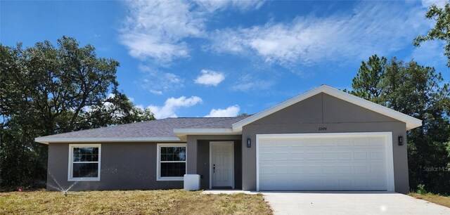 single story home with a garage