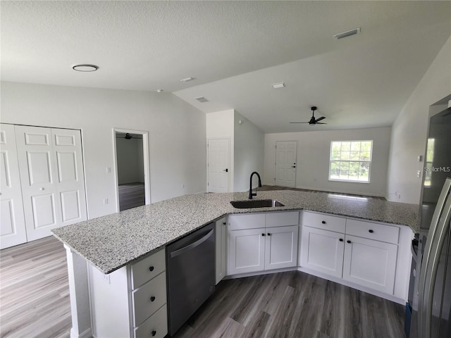 2688 SW Wave Ln, Dunnellon, FL 34431 - kitchen with a sink, stainless steel dishwasher, ceiling fan, lofted ceiling, and wood finished floors