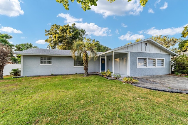 ranch-style home with a front lawn