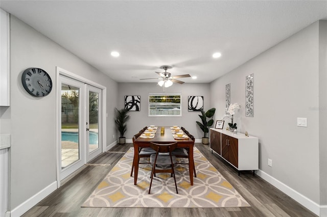 dining space featuring dark hardwood / wood-style floors, ceiling fan, and a healthy amount of sunlight