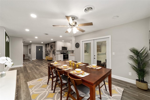 dining space with ceiling fan and dark hardwood / wood-style flooring