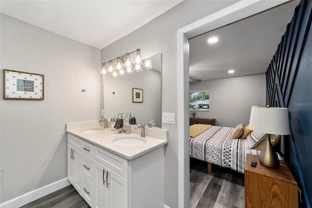 bathroom with hardwood / wood-style floors and vanity