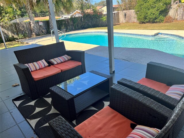 view of swimming pool with outdoor lounge area and a patio area