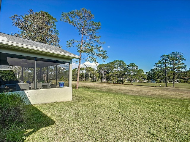 view of yard with a sunroom