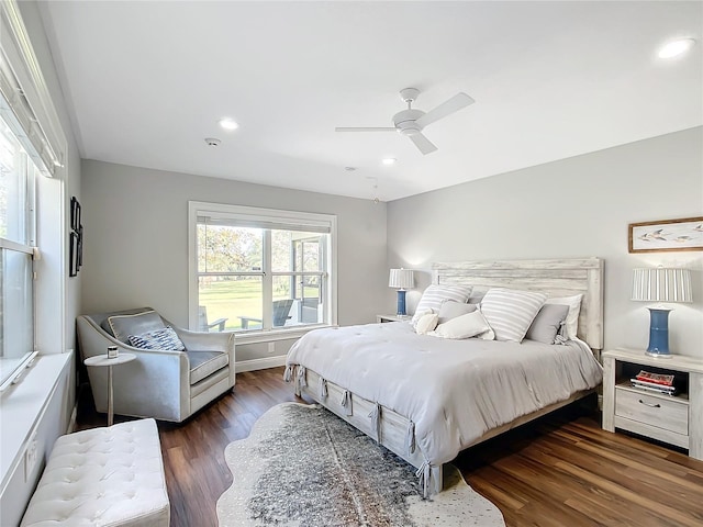 bedroom with ceiling fan and dark wood-type flooring