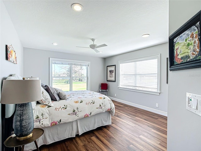 bedroom featuring dark hardwood / wood-style floors and ceiling fan