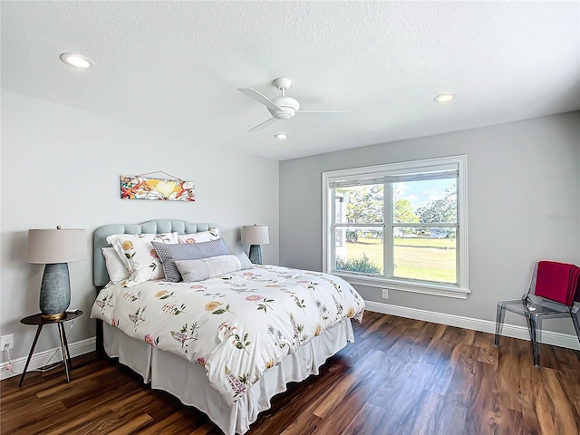 bedroom featuring ceiling fan and dark wood-type flooring