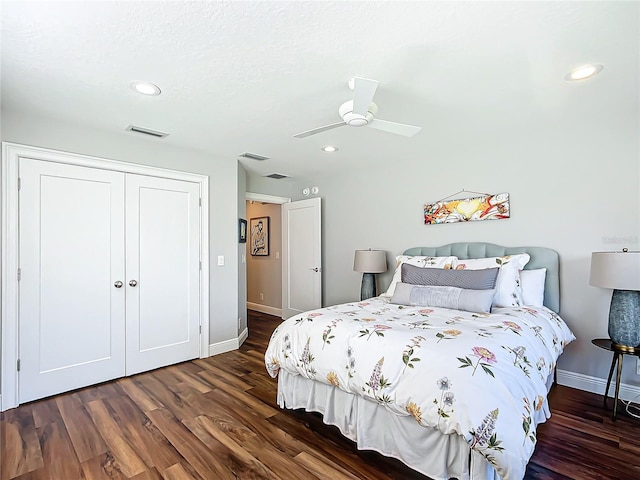 bedroom with a closet, ceiling fan, and dark wood-type flooring