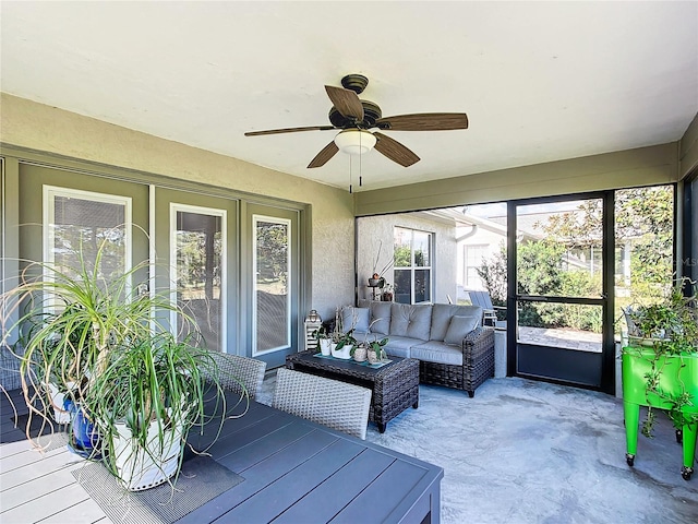 sunroom / solarium with ceiling fan