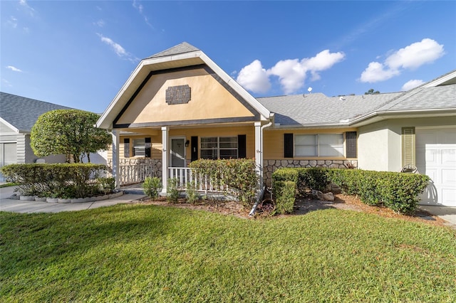 view of front of property with a front lawn, a porch, and a garage