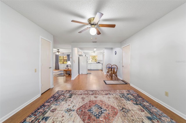 interior space with light hardwood / wood-style floors and a textured ceiling