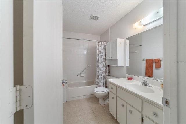 full bathroom featuring tile patterned flooring, a textured ceiling, toilet, shower / tub combo with curtain, and vanity