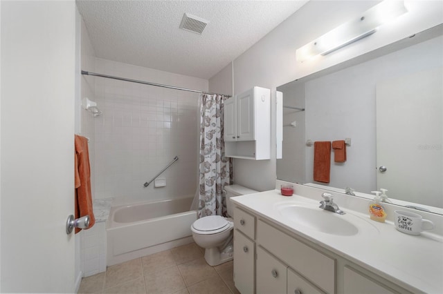 full bathroom with vanity, shower / bath combination with curtain, tile patterned flooring, toilet, and a textured ceiling