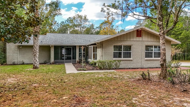 ranch-style house with a front lawn