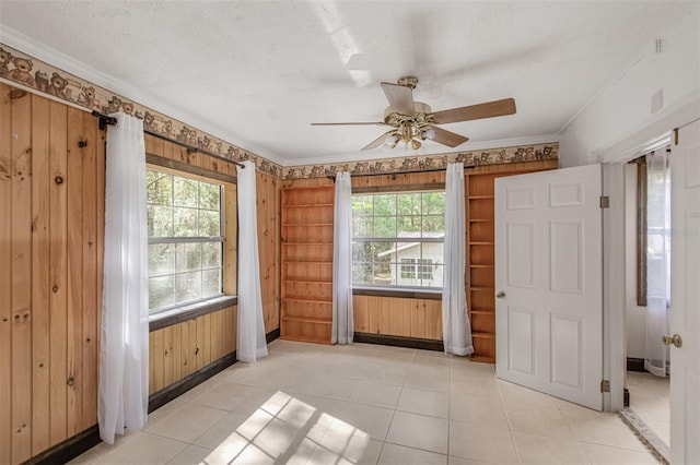 interior space with ceiling fan and a healthy amount of sunlight