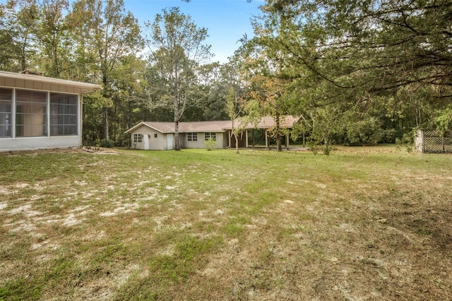 view of yard featuring a sunroom