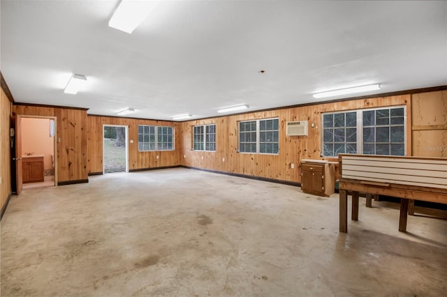 miscellaneous room with wooden walls and a wall mounted AC