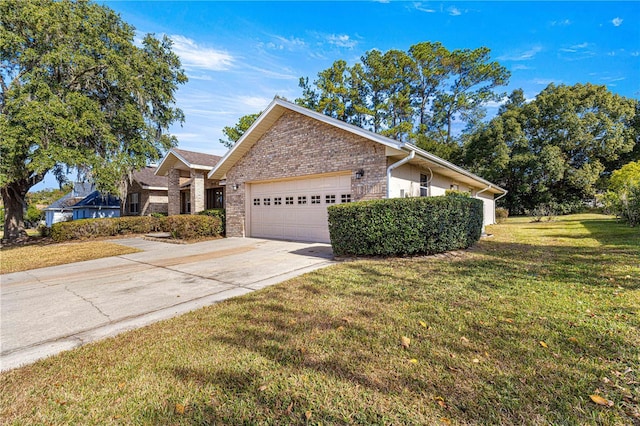 view of front of property featuring a garage and a front lawn