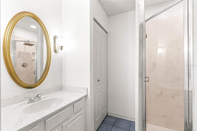 bathroom with tile patterned floors, vanity, and an enclosed shower