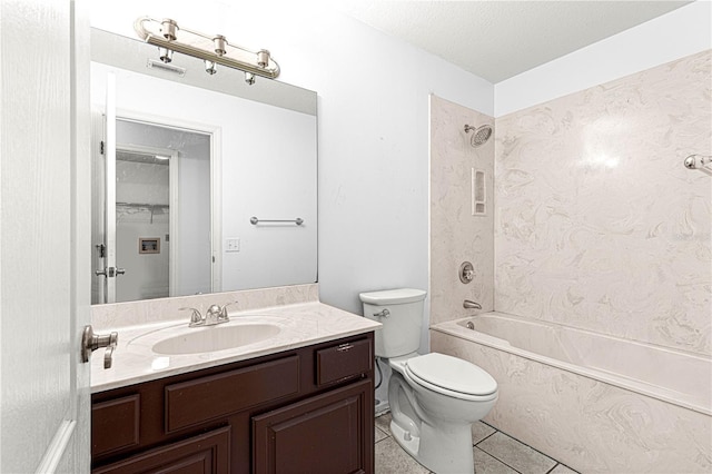 full bathroom featuring tile patterned flooring, a textured ceiling, toilet, vanity, and tiled shower / bath