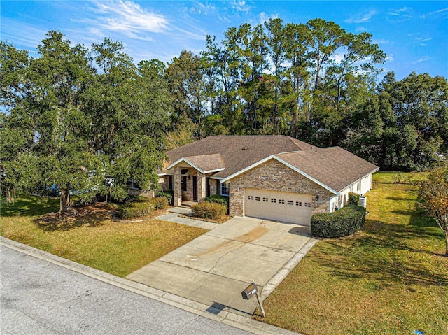 view of front of home with a garage and a front yard