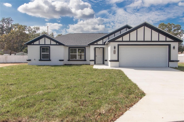 view of front facade with a garage and a front yard