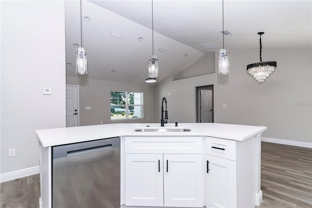 kitchen featuring white cabinetry, sink, stainless steel dishwasher, and vaulted ceiling