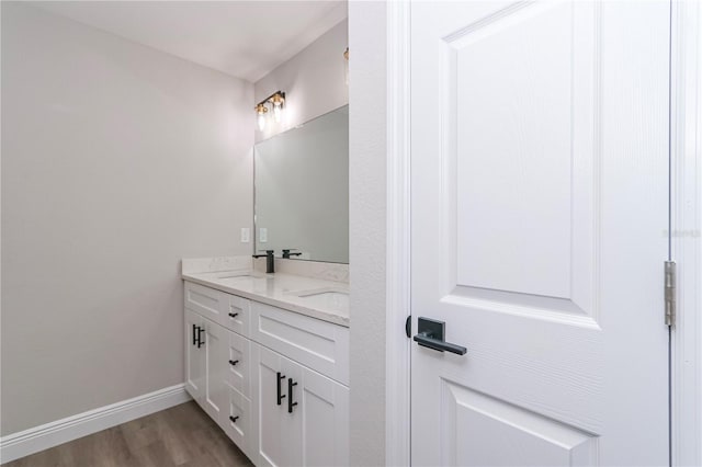 bathroom featuring hardwood / wood-style floors and vanity