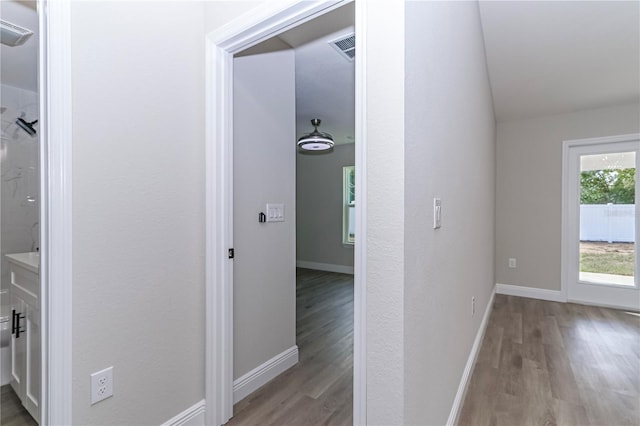 hall with light hardwood / wood-style floors