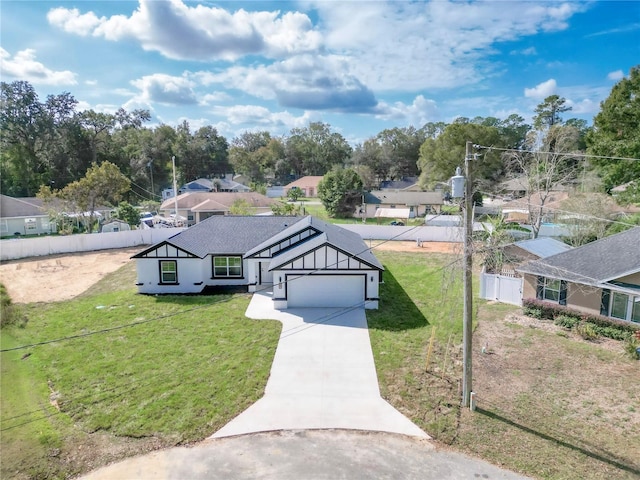 view of front facade with a garage and a front lawn