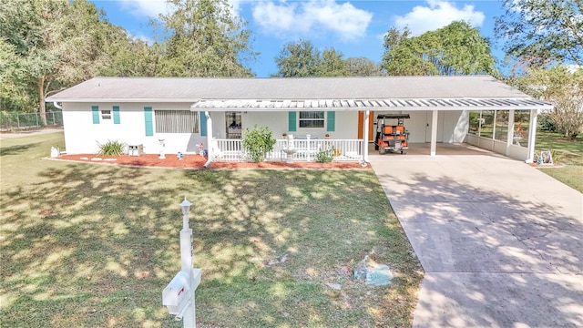 single story home with a carport, covered porch, and a front yard