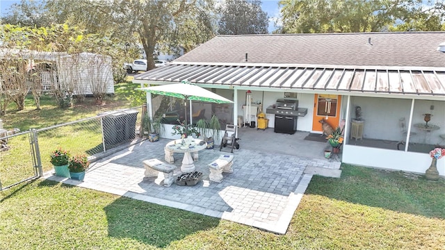 view of patio with a sunroom and grilling area