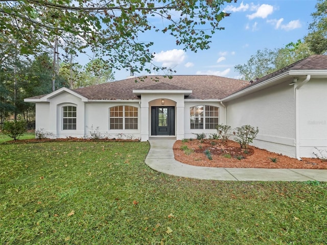 ranch-style home with a front lawn