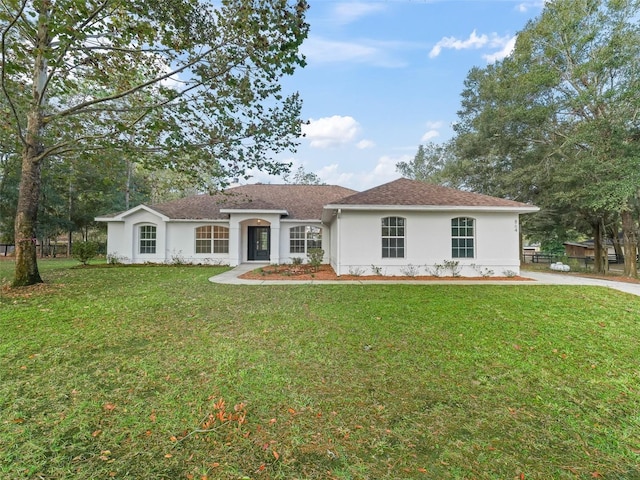 single story home with a front lawn