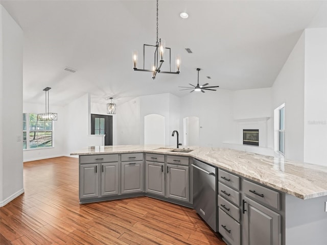 kitchen with dishwasher, light wood-type flooring, and gray cabinetry