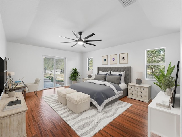 bedroom with access to outside, ceiling fan, and dark hardwood / wood-style flooring