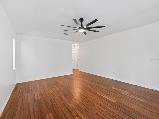 empty room featuring hardwood / wood-style floors and ceiling fan